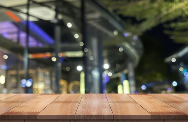 Wooden top table with bokeh light effect and blur restaurant on background, blur background.