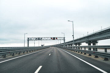 Empty highway with asphalt road and cloudy sky