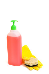 Plastic bottle of detergent and rubber glove with sponge on white background