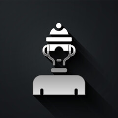 Obraz premium Silver Winter athlete icon isolated on black background. Long shadow style. Vector.