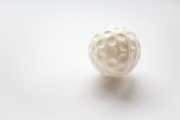 Plastic white ball on a white background close-up 