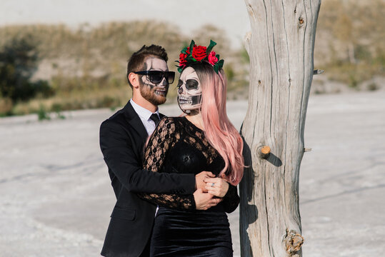 Evil day of the dead undead couple posing