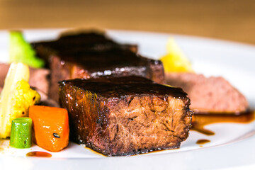 Ostrich steak with fresh vegetables.The food in the restaurant. Food styling and restaurant meal serving.