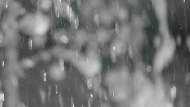 Blurred drops of blue water make up the motion background