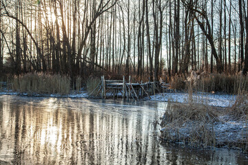 Wooden pier on a frozen lake