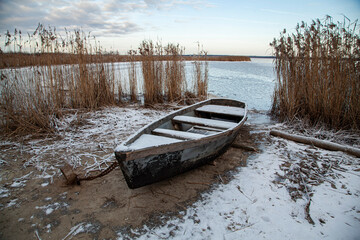 Boat on the shore of the lake