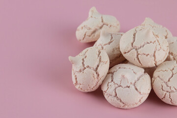 meringues on a pink background