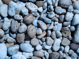 pebbles on the beach, white stone background