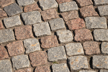 Paving stones close-up, stone pavement texture, abstract background