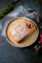 honey cake with honeycombs and christmas decorations and lights. sweet dessert for the holiday, top view