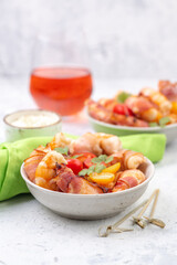Fried large prawns without shell wrapped in bacon with fresh vegetables and creamy sauce.