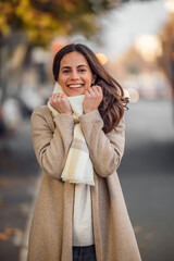 Dressed casually female, looking happy.