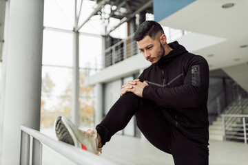 Active man doing exercises in his training studio.