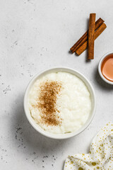 Classic vanilla rice pudding in bowls. Top view, space for text.