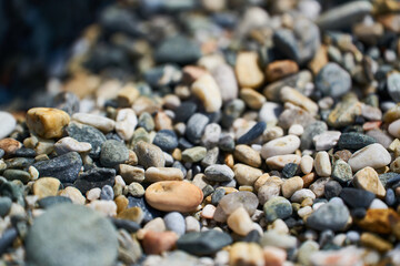 close up of the small stones of a beach in Andalucía