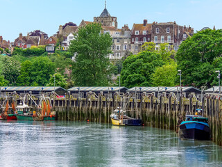 A view of boats moored on the River Rother in the town of  Rye, Sussex