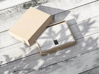 Open cardboard Gift Box Mockup with white wrapping paper on wooden table outdoors
