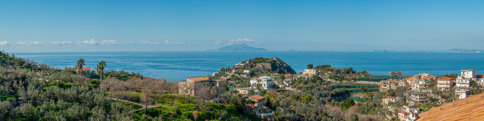 Obraz premium Panorama of Massa Lubrense, near Sorrento, with Ischia and Procida on the horizon