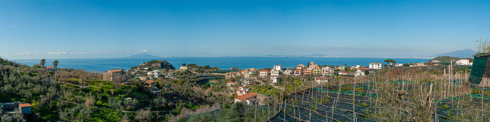 Panorama of Massa Lubrense with its lemon groves, Ischia, Procida and Vesuvius in the distance