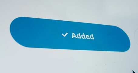 Macro video shot of cursor clicking add to cart button on device screen slow motion. Faceless person doing digital online shopping on website. Mock up application product ordering