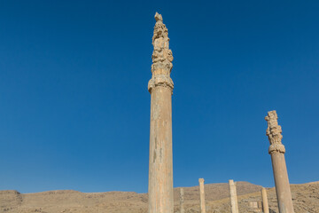 Ruins of columns in the Persepolis in Shiraz, Iran. The ceremonial capital of the Achaemenid...