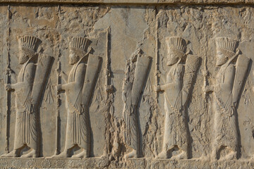 Bas relief on the wall of ruins in the Persepolis in Shiraz, Iran. The ceremonial capital of the Achaemenid Empire. UNESCO World Heritage