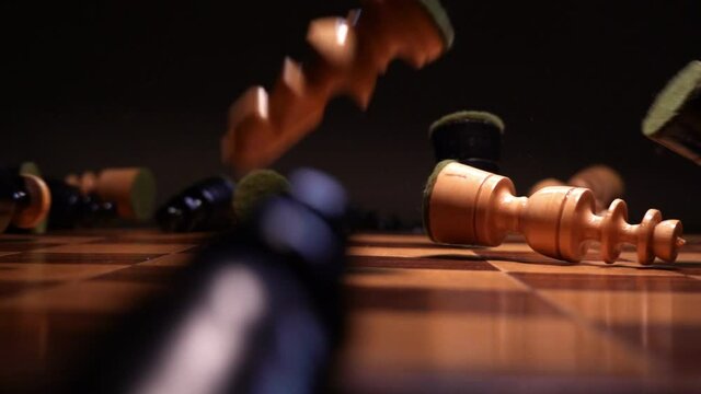 Wooden Chess Pieces Dropped on Chessboard Slow Motion