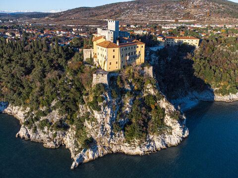 Aerial view of gothic Duino castle on a cliff over the Gulf of Trieste , Italy. 