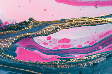 Gold wave bubbles on mixing green and pink paints. Fluid Art. Marble effect background or texture
