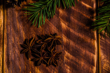 Christmas cones and branches on wooden boards. - 401243726