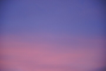 Abstract blurred pink purple and blue gradient colorful clouds and sky sunset on evening nature background.