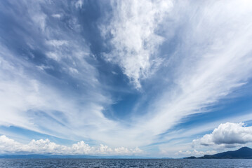 blue sky with clouds over the sea