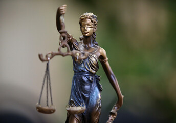 Law and Justice concept with scale and Themis in background. Composition in court