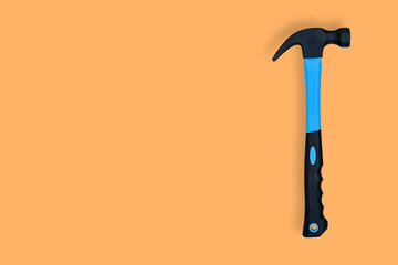 Hammer on an orange background. Hammer seamless pattern.