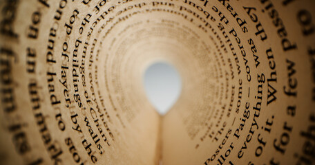 inside the rolled up sheet of paper with text from book