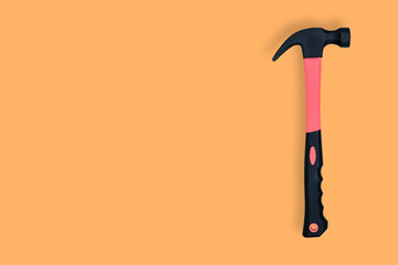 Hammer on an orange background. Hammer seamless pattern.