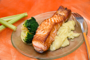 healthy grilled salmon with broccoli and mashed potatoes. healthy dish