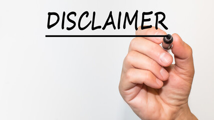 the hand writes text DISCLAIMER with a marker on a white background. business concept