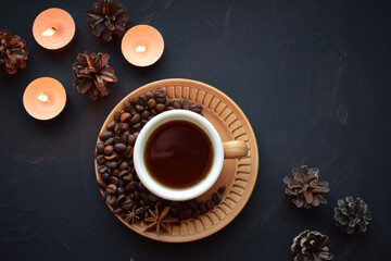 Obraz na płótnie Canvas Fresh aromatic coffee in a Cup on a black background.