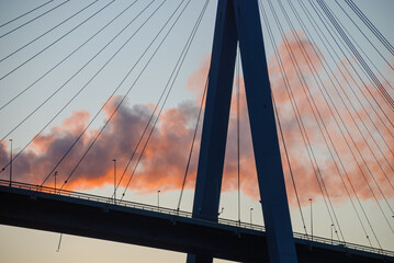 Fototapeta na wymiar Hamburg, Germany: Pylon of the Koehlbrand Bridge in Hamburg in the ligth of the sunset