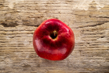 delicious juicy red Apple on a wooden background