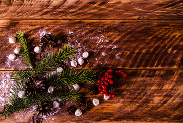 red viburnum. Christmas cones and branches on wooden boards with marshmallows - 401255908