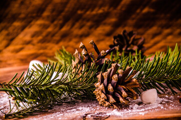 red viburnum. Christmas cones and branches on wooden boards with marshmallows