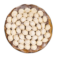 top view of many frozen Pelmeni (russian dumplings filled with minced meat) on wooden board isolated on white background