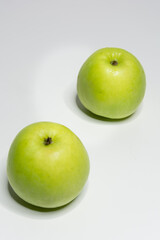 Green apple with white background and space for text