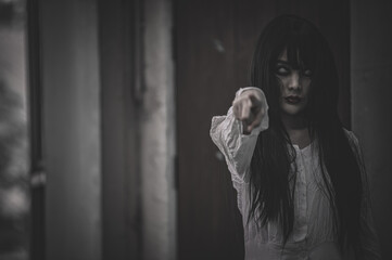 Portrait of asian woman make up ghost,Scary horror scene for background,Halloween festival concept,Ghost movies poster