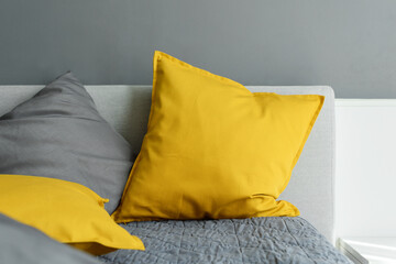 illuminating yellow ultimate gray pillows on bed