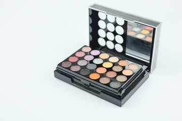 Multicolored eye shadows palette isolated on white. Soft shadow