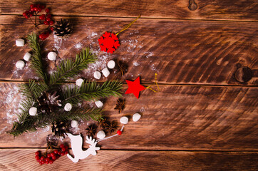 red viburnum. Christmas cones and branches on wooden boards with marshmallows - 401262122