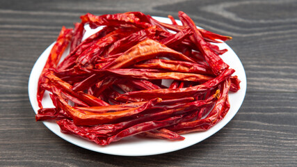 red dried hot peppers on a plate